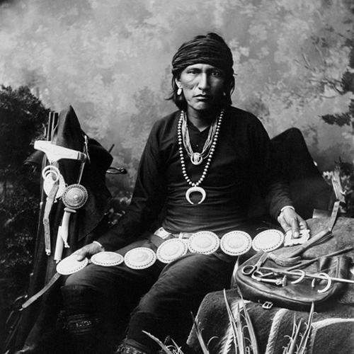 Silversmith wearing studio necklace